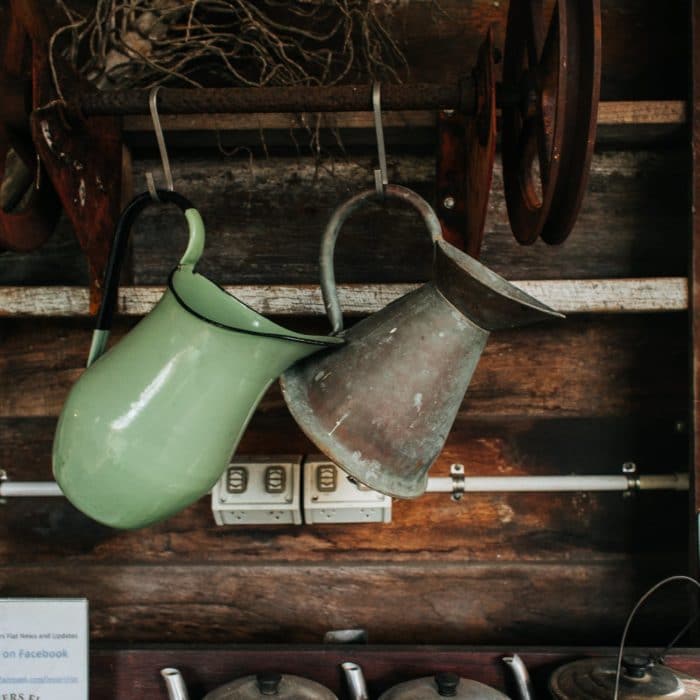 hanging pitchers and old tea pots