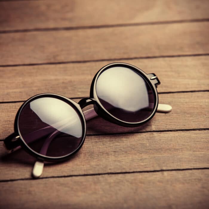 Retro steampunk sunglasses on wooden tableRetro sunglasses on wooden table